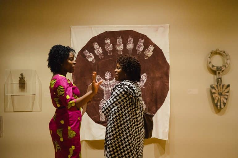 Alvine Kamaha and Nomusa Mngoma, members of the advisory committee for Stories to Tell, in the exhibition, 2016