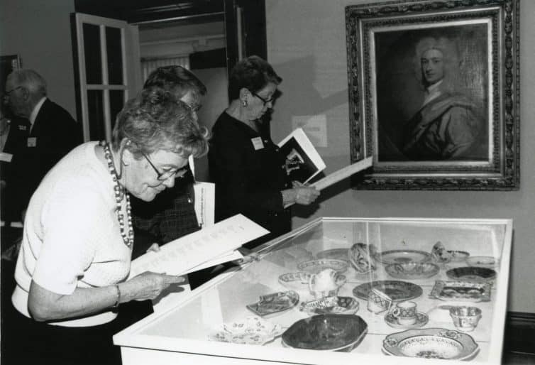 Participants admire antique ceramic tableware at Perfect Setting, the second David and Patty Bain Decorative Arts Program, 1993