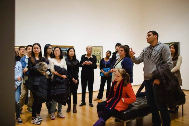 Janet Robertson, community docent, leads tour for international students, 2016