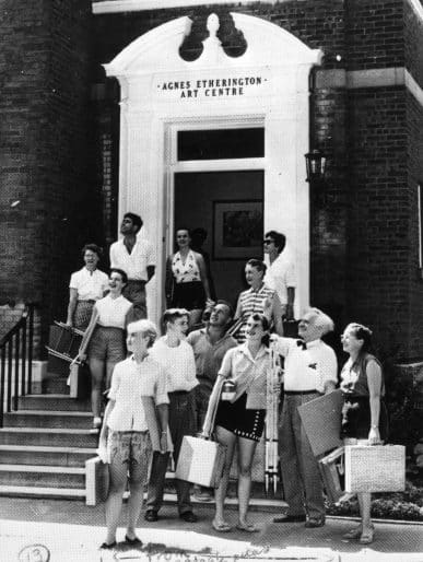 André Biéler and art students at the entrance of the new Agnes Etherington Art Centre, 1958