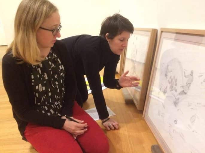 Jennifer Nicoll, Collections Manager, assessing artwork with Marla Dobson, Collections Assistant, 2017
