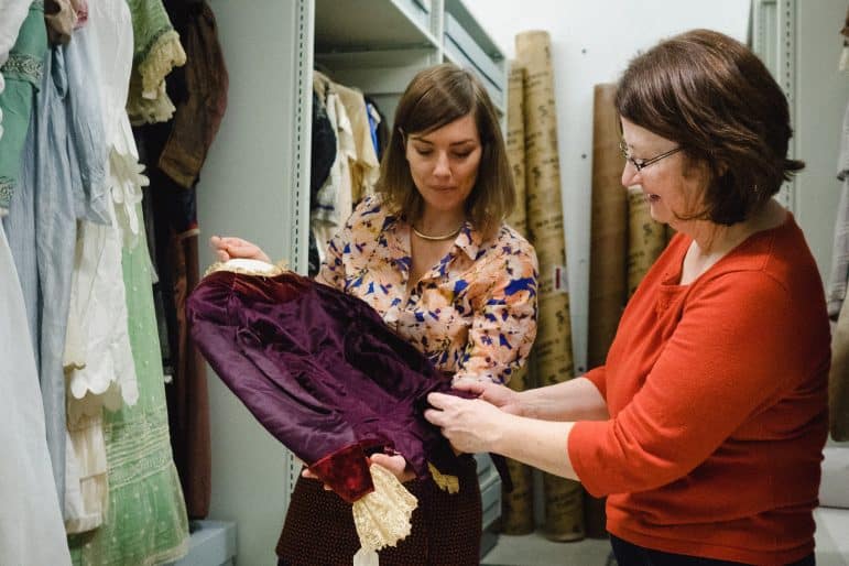 Emma Neale and Elaine MacKay, Isabel Bader Graduate Intern and Fellow in Textile Conservation and Research, with the Queen’s University Collection of Canadian Dress, 2015