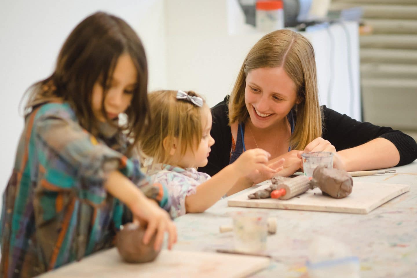 Kids in the studio with an art educator.