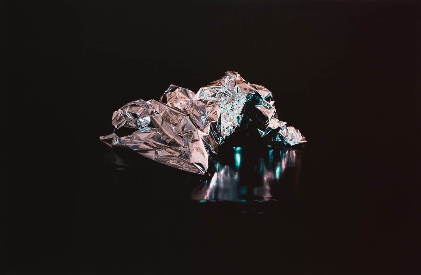 Image of Teresa Carlesimo's artwork titled, "a form of unrest, II." Pictured here: a vinyl printed digital image of a crumpled up emergency blanket.
