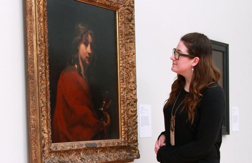Art history student Madeleine Leisk (Artsci’16) is drawn to Willem Drost’s Self-Portrait as St. John the Evangelist (c.1655). Ms. Leisk assisted in the preparation of the Singular Figures exhibition. Photo: Bernard Clark