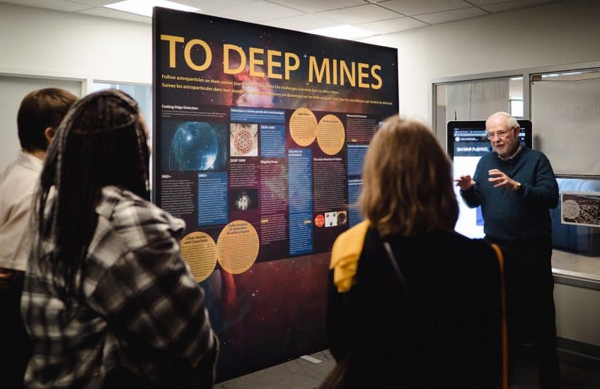 Arthur B. McDonald discusses dark matter and his Nobel Prize winning research with the Drift: Art and Dark Matter team, including artists Nadia Lichtig and Josèfa Ntjam. Photo: Tim Forbes