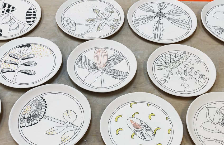 Hand illustrated porcelain plates created by Marney McDiarmid