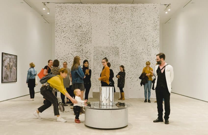 Visitors enjoy The hold: movements in the contemporary collection.