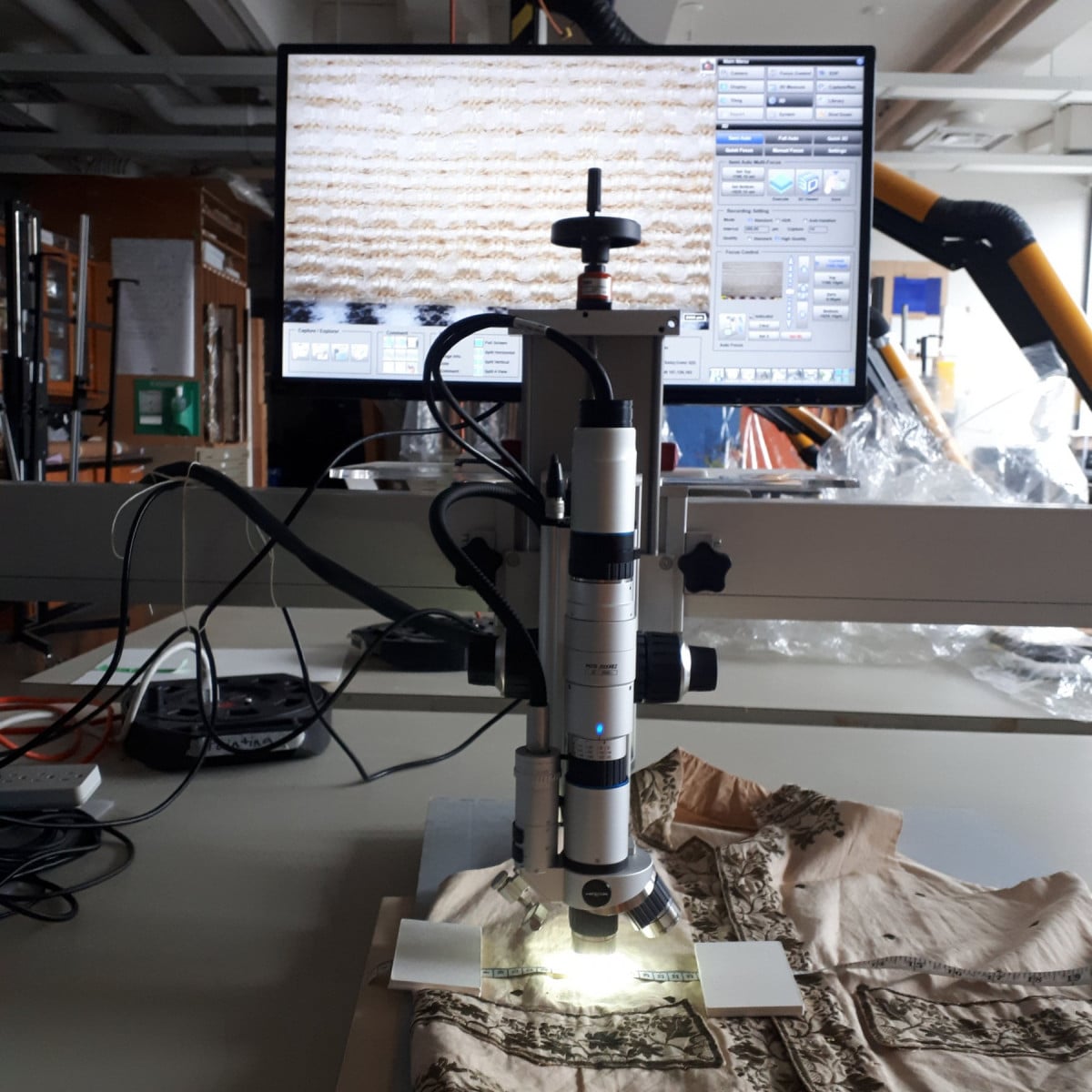 Hirox microscope is set up to look at a cotton embroidered vest in Agnes's collection at the Art Conservation lab, Queen's University.