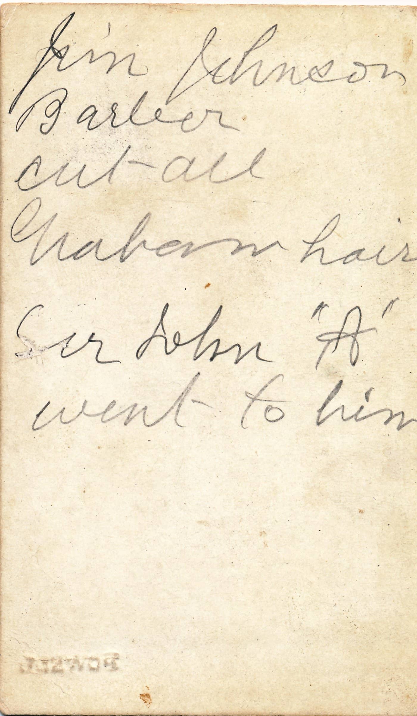 The verso of a calling card with cursive handwriting on it. The card says, "Jim Johnson, Barber cut all [illegible] hair. Sir John "A" went to him."