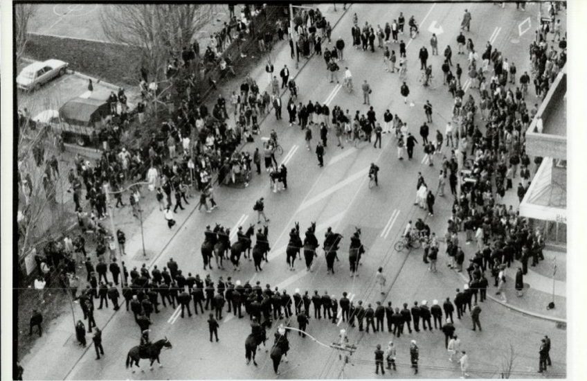 Mounted Metro police officers and others on foot confront a crowd downtown on May 4, 1992, to quell vandalism and looting. Photo: John Mahler, The Toronto Star, 4 May 1992