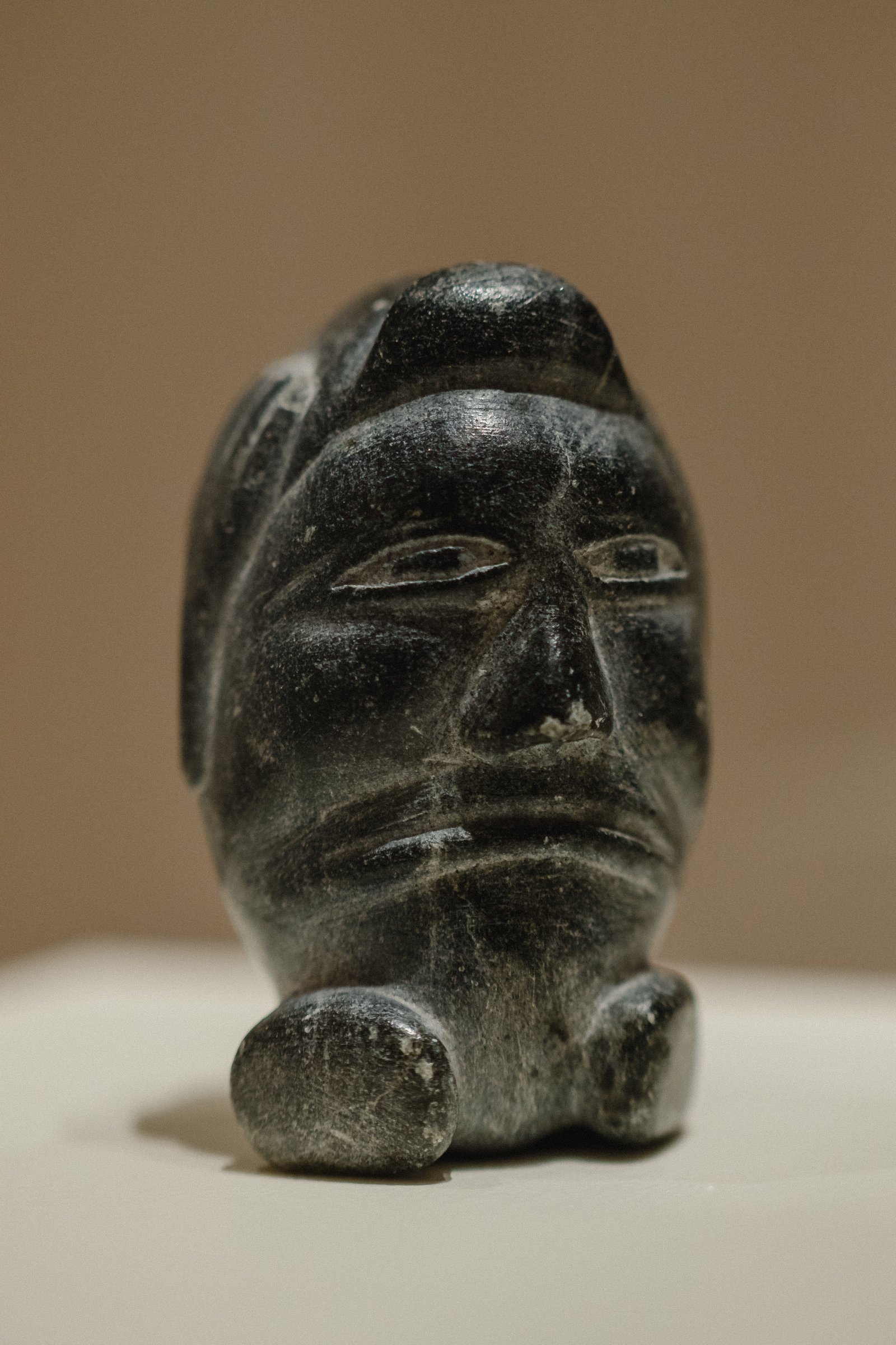 Isah Papialuk, Head (Hear No Evil), unknown date, soapstone. John and Mary Robertson Collection of Inuit Art, 1990