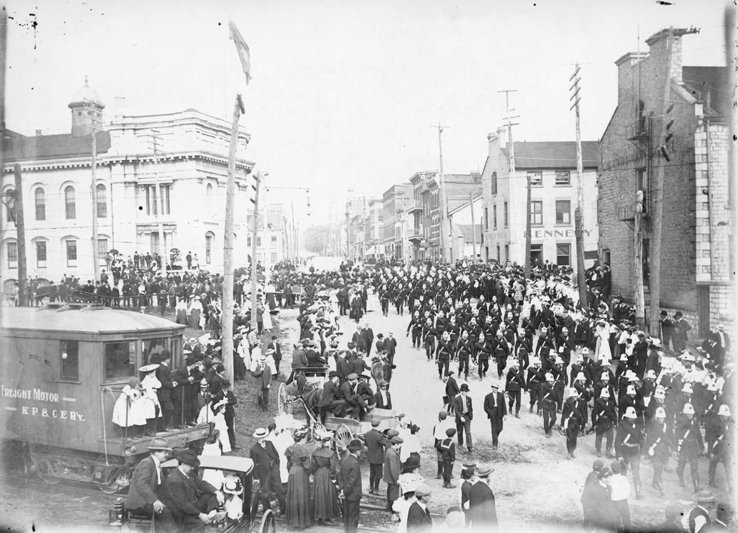 Military parade at the corner of Brock and Ontario Streets in Kingston, Ont. 1890. (Queen's University Archives)