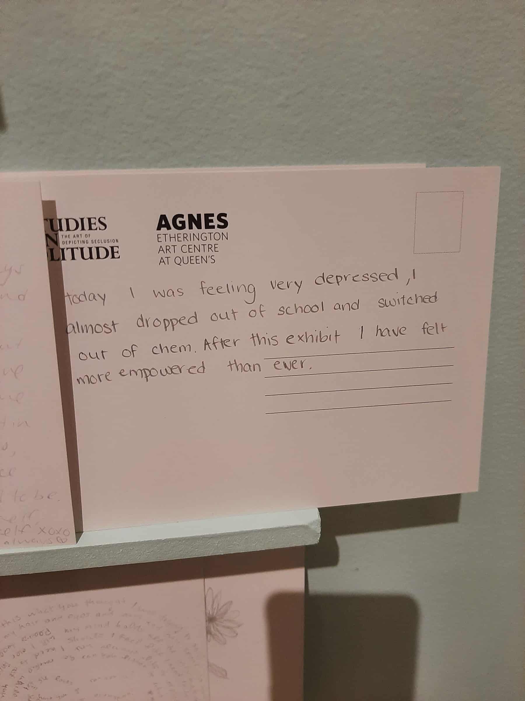 Postcard with text reading “Today I was feeling very depressed, I almost dropped out of school and switched out of chem. After this exhibit I have felt more empowered than ever.”