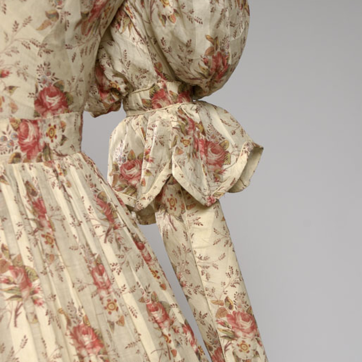A detail of the sleeve of the Day Dress and floral print of the fabric.