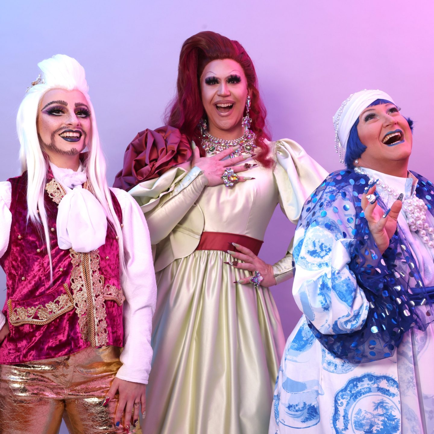 Three drag artists wearing re-imagined historical garments.