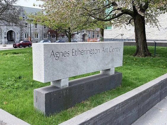 Stone sign with Agnes Etherington written on it, standing in front of the former gallery