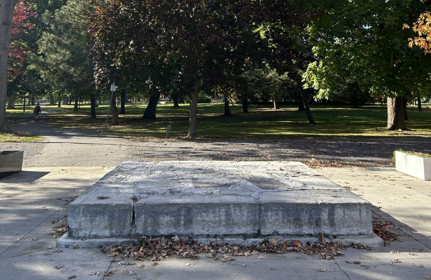 Empty stone platform in a park on a sunny day